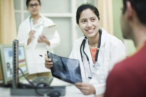 orthopedics doctor holding x-ray