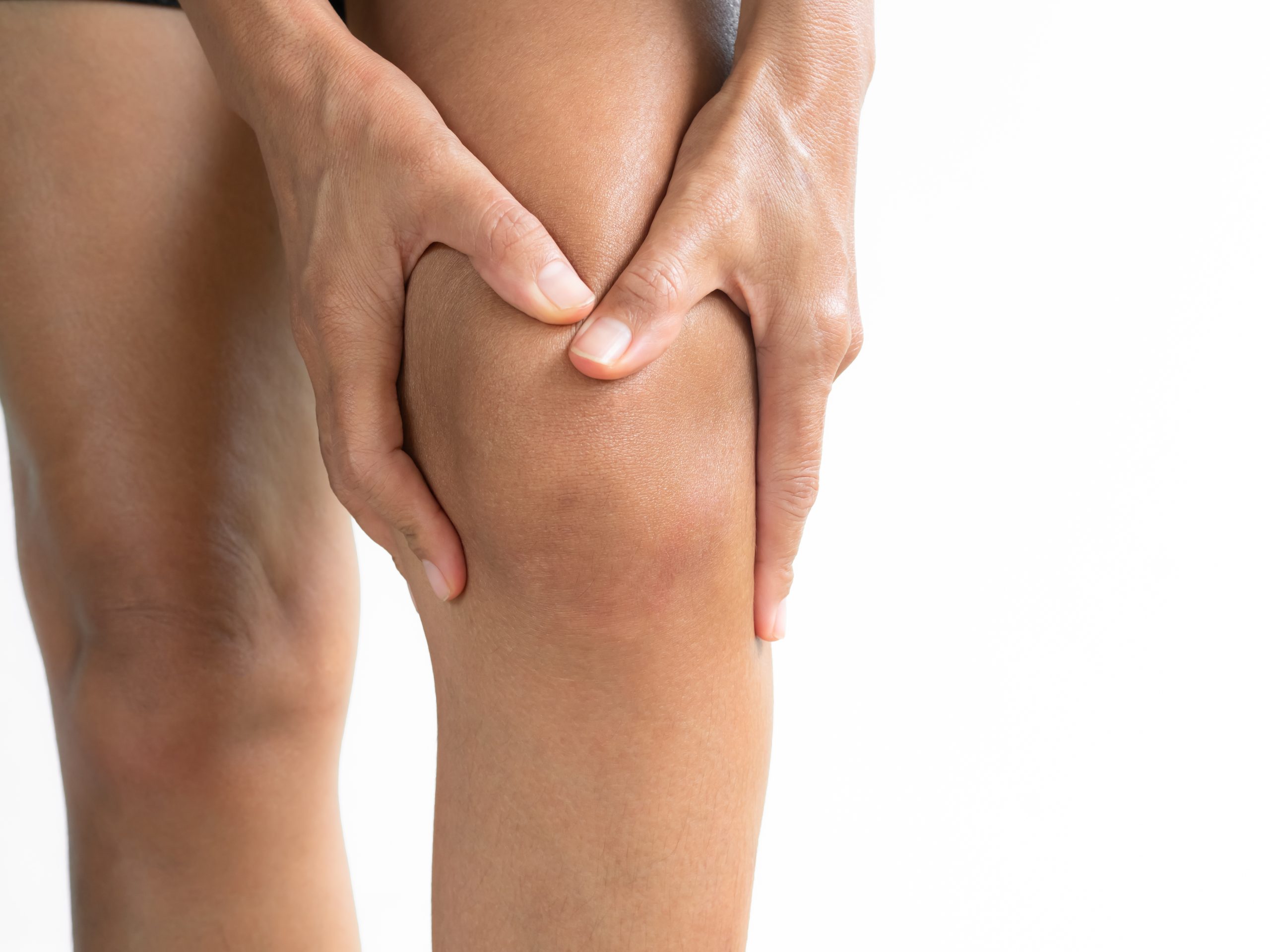 Image of person holding knee in pain